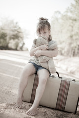 Little Girl with Ragged Teddybear and Suitcase - Poverty, Homelessness, Runaway Child