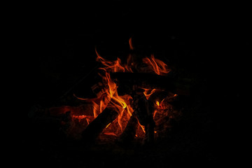 Logs of wood, burn bright red fire.  Flame of fire.