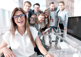 Canvas Print - business woman on the background of the business team