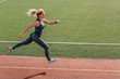 © Viktoriia - Sporty Lifestyle. Young woman on stadium running determined side view