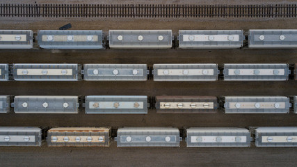 aerial view of freight trains. rail cars with goods on railroad. top view of colorful freight train 