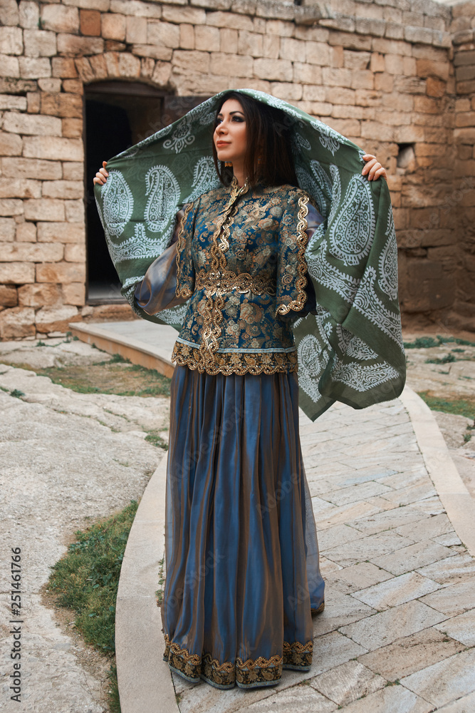 Beautiful middle eastern woman wearing traditional dress Stock Photo |  Adobe Stock