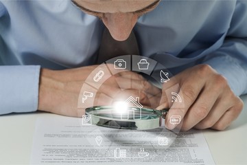 Wall Mural - Businesswoman Holding Magnifying Glass, close-up view