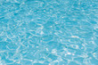 Blue water in pool for background and abstract, Ripple wave with sun reflection in swimming pool, Clean and bright purified water for healthy swimming