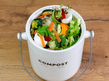 Recycle Food Waste Kitchen Compost Collecting Bin Containing Kitchen Waste On Counter Top	Sustainable Living 