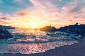 Tropical beach with sunset sky and cloud background.