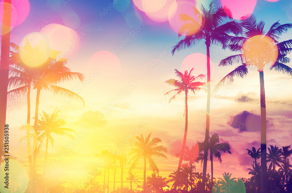 Tropical palm tree with colorful bokeh sun light on sunset sky cloud abstract background. - obrazy, fototapety, plakaty 