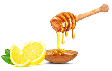 Wall Mural - honey dripping in a bowl and lemon isolated on white