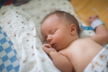 Newborn baby right after giving birth in hospital