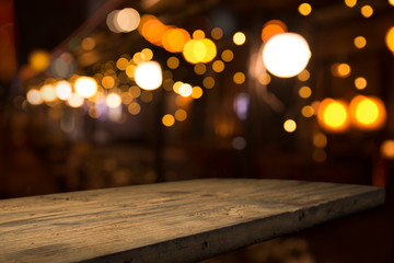 Wall Mural - Beer barrel with beer glasses on a wooden table. The dark brown background.