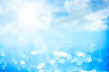 Wall Mural - blur tropical beach with bokeh sun light wave abstract background.