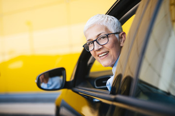 Wall Mural - Mature women at car 