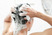 Closeup Young Man Washing Hair With With Shampoo In The Bathroom, Health Care Concept