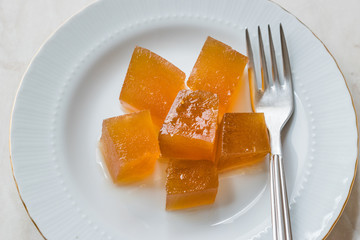 Wall Mural - Turkish Crispy Pumpkin Dessert from Hatay / Kirecte Kabak Tatlisi with Walnut Powder.