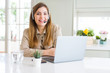 © Krakenimages.com - Beautiful young operator woman working with laptop and wearing headseat happy face smiling with crossed arms looking at the camera. Positive person.