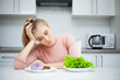 © Maksymiv Iurii - Dieting concept. Young Woman choosing between Fruits and Sweets