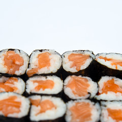 Wall Mural - Sushi Roll with salmon on the white background .Food abstract background