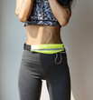 © black_J - Slim woman with exercise suit and waist bag