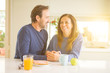 © Krakenimages.com - Beautiful romantic middle age couple having healthy breaskfast in the morning at home