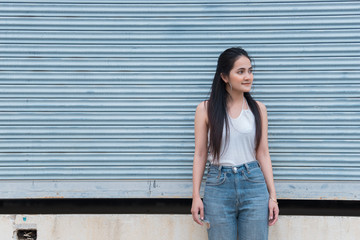 Portrait of beautiful asian chic girl pose for take a picture on wall background,Lifestyle of teen thailand people,Modern woman happy concept