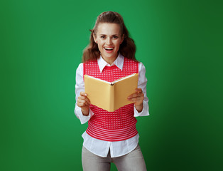 Wall Mural - happy healthy student woman holding opened yellow book