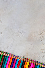 Poster - Mady Pecils of different colors on cement grey background Kid, Children, Education, Art, Drawing, Graphic, Copy space, Empty, three fingers grip, neuro psychology skills, right whtiring position