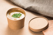 Soup in a disposable cup of craft paper