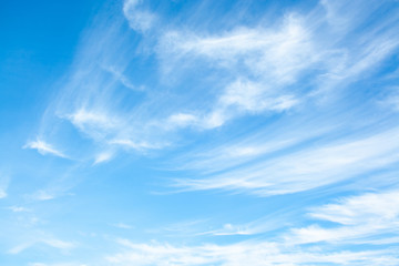 white clouds high in the sky at windy winter day background