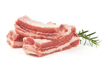 Wall Mural - Raw pork ribs with rosemary, close-up, isolated on white background