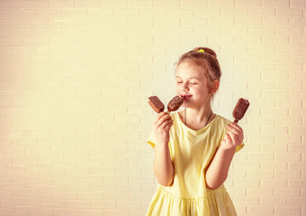 Wall Mural - Happy little girl eating popsicle at summer time, retro effect