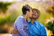© Erickson Stock - Senior woman kissing her happy husband.