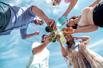 Group of attractive young people enjoying on the beach