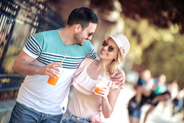 Wall Mural - Young couple drinking healthy juice