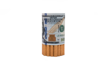 Smoking and money cost. Cigarettes wrapped in hundred dollars banknotes isolated on white background.