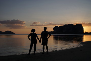 Canvas Print - couple on the beach at sunset