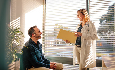 Doctor sharing good test results with patient