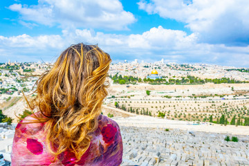 Wall Mural - Woman is looking at Jerusalem from the mount of olives, Israel