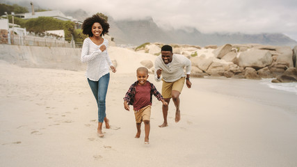 Sticker - Young family playing on the beach