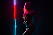 Leinwandbild Motiv Pole dance girl with perfect body in black sexy lingerie. Night club concept