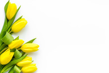 Spring Composition. Delicate Yellow Tulips On White Background Top View Space For Text Border