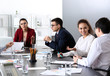 © Pixel-Shot - Young people having business meeting in office
