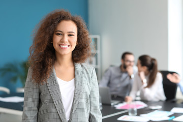 Young businesswoman at meeting in office