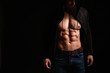© Pixel-Shot - Muscular sexy bodybuilder on dark background