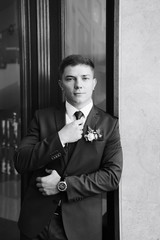 the groom in a wedding suit, a man preparing for the wedding 1