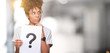 © Krakenimages.com - Young african american woman holding paper with question mark over isolated background serious face thinking about question, very confused idea