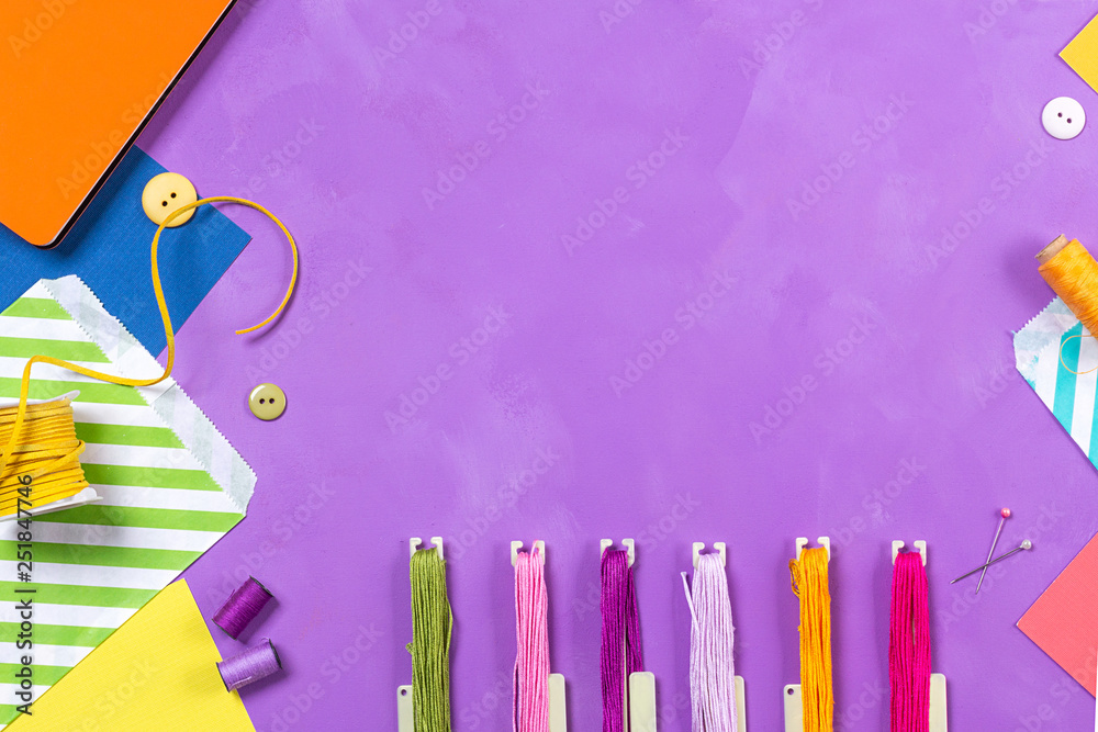 Multicolored craft supplies on bright background with copyspace. Sewing ...
