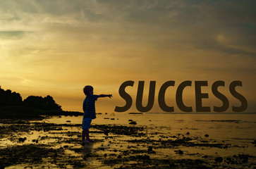 child points to the text of the success on the sunset background