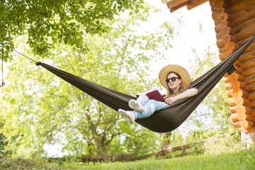 gorgeous young woman in a hammock in the nature