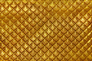 Abstract background texture of an old natural luxury, gold modern style leather with rhombs.