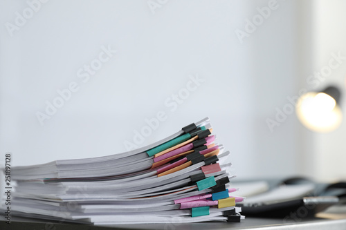 Fotografía Stack of documents with paper clips on office table